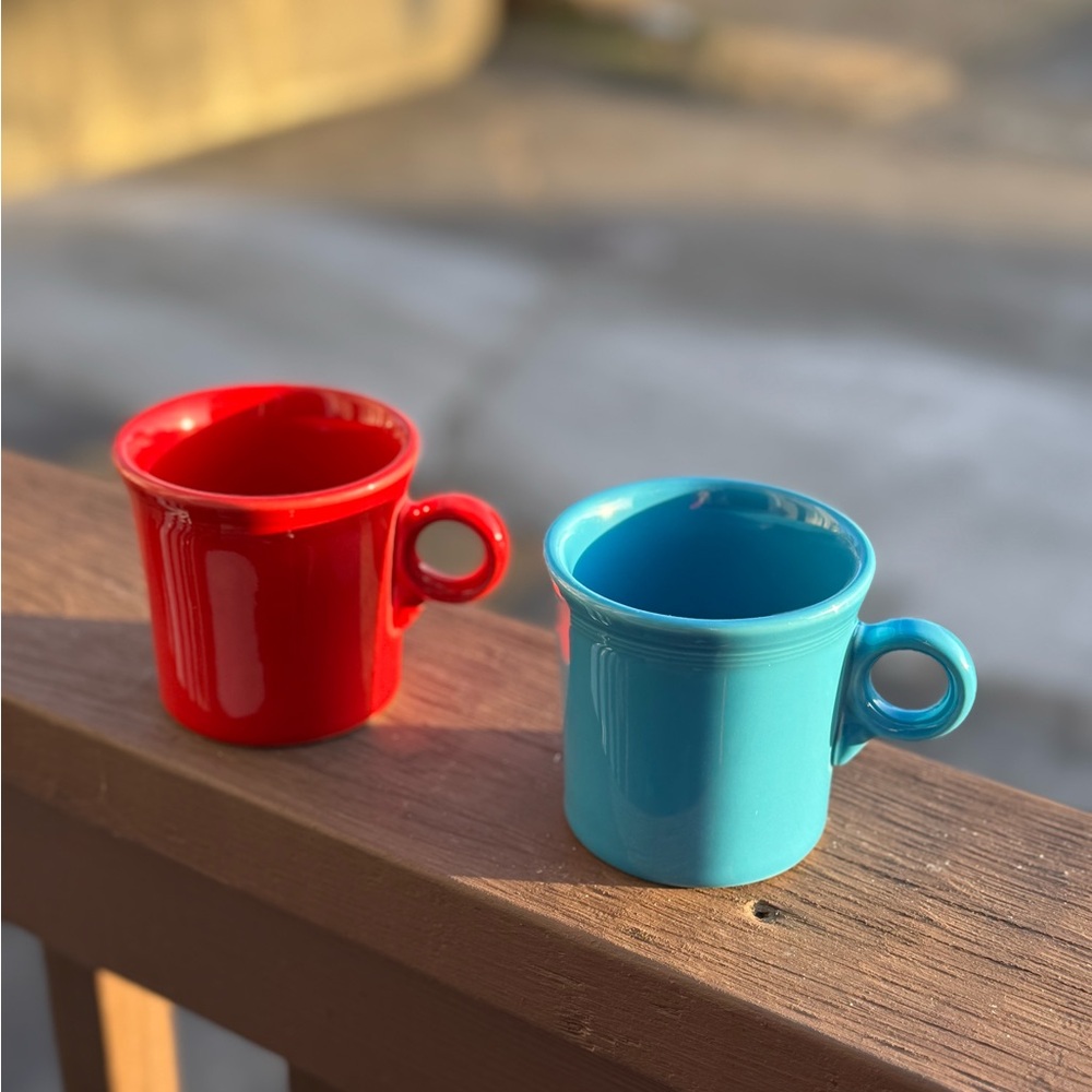 2 Fiestaware mugs.  Gently used. Peacock blue and scarlet red.